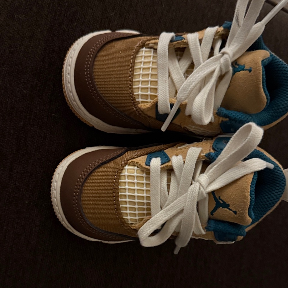 Kids Brown and Blue Sneakers

Jordan Baby Shoe size 5c worn once & was too small